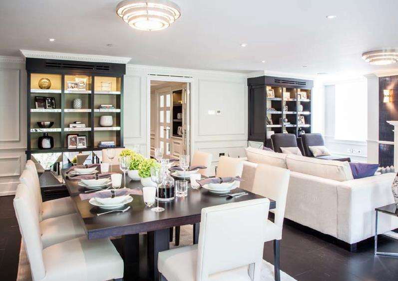 The dining area and library joinery in a completed Soho Square apartment.