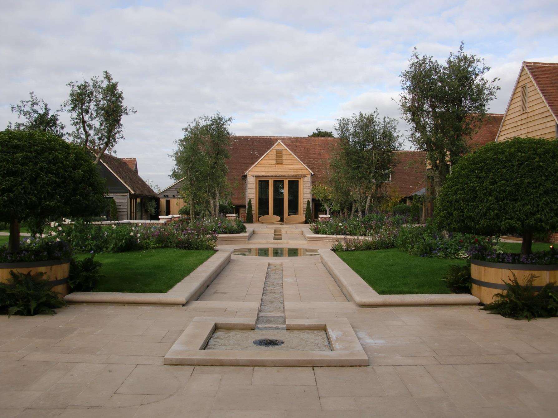 The formal garden at Huttons Farm, a stone rill running on axis toward the house.