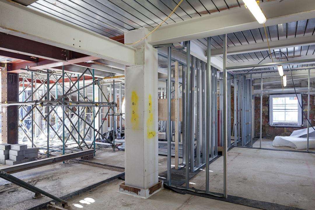 Internal steel frame and temporary propping within Oceanic House during conversion.