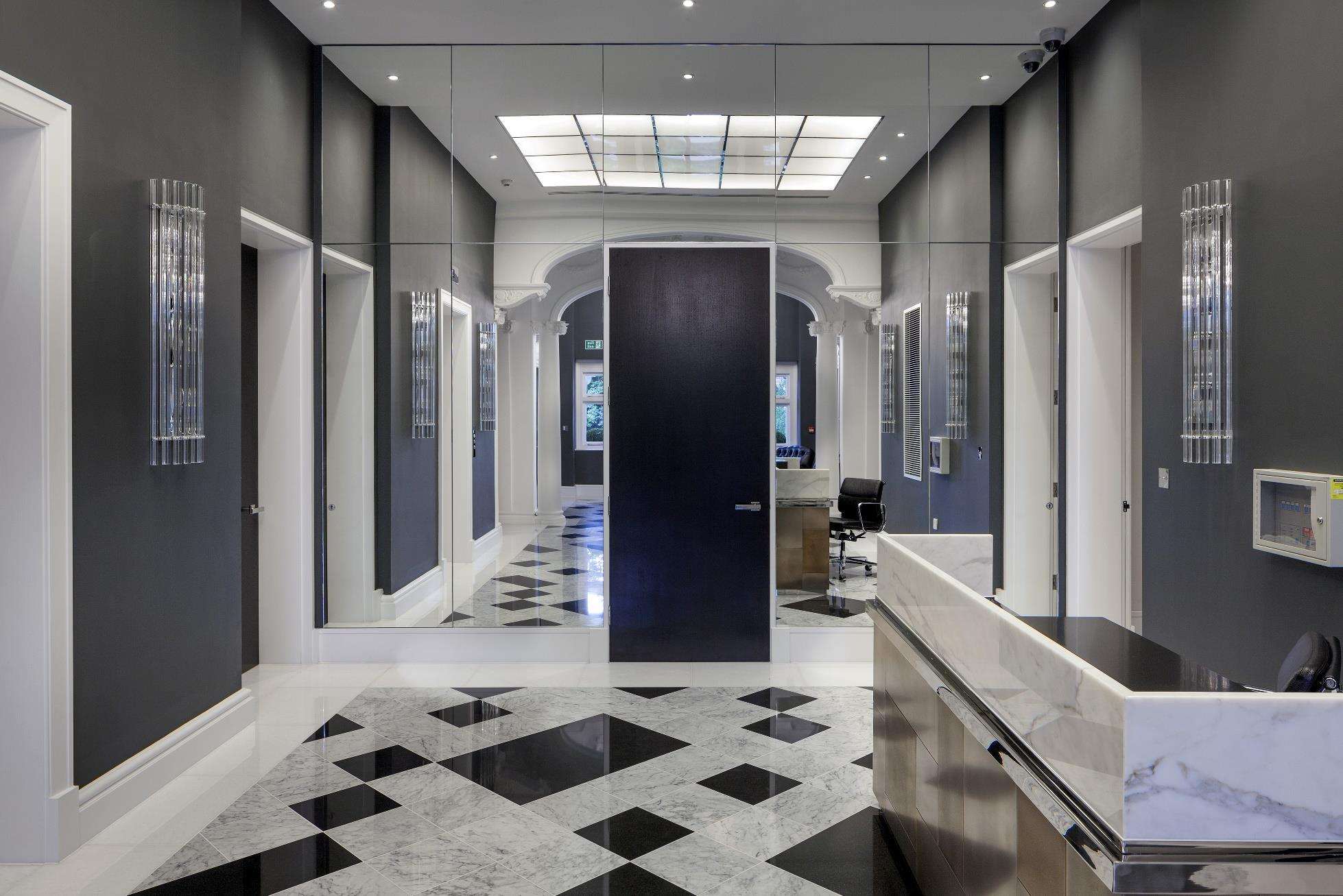 The basement swimming pool at One Highgate, flanked by a colonnade.