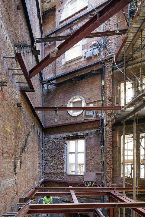 The retained brick shell of Oceanic House with new steelwork threaded through it.