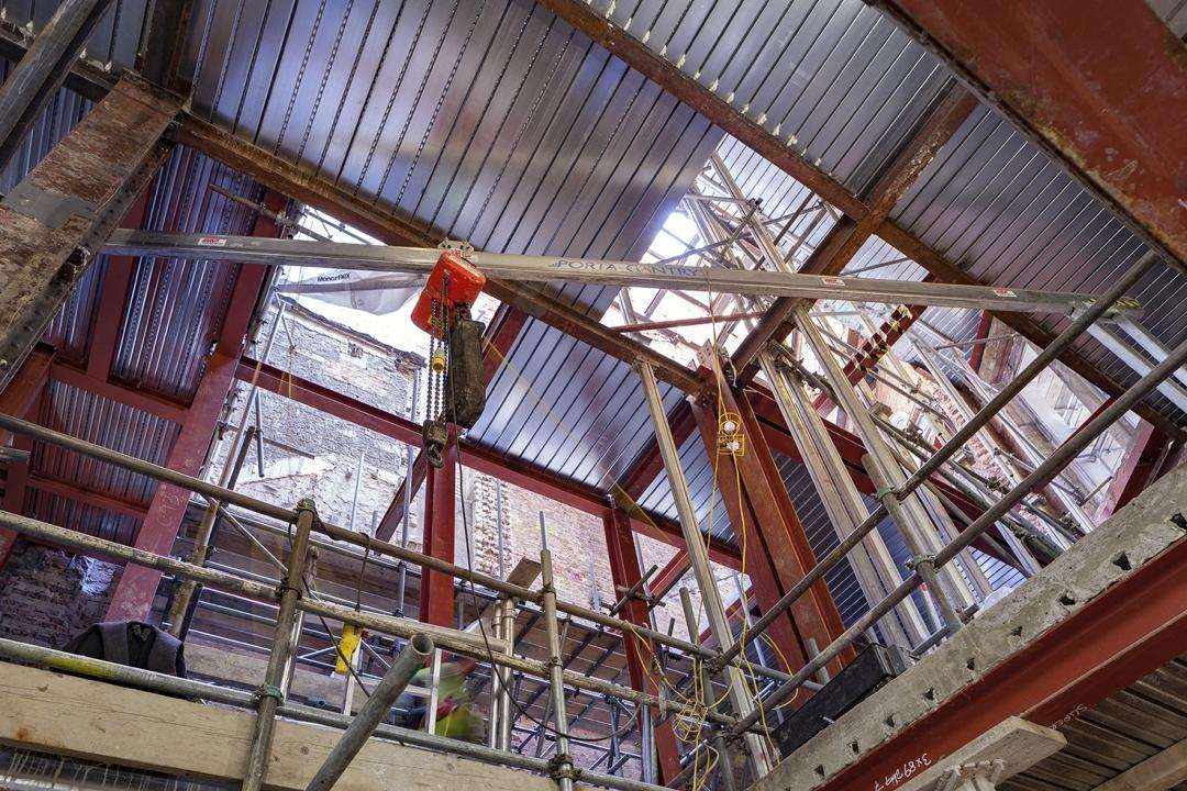 New roof steelwork being installed above the retained structure at Oceanic House.