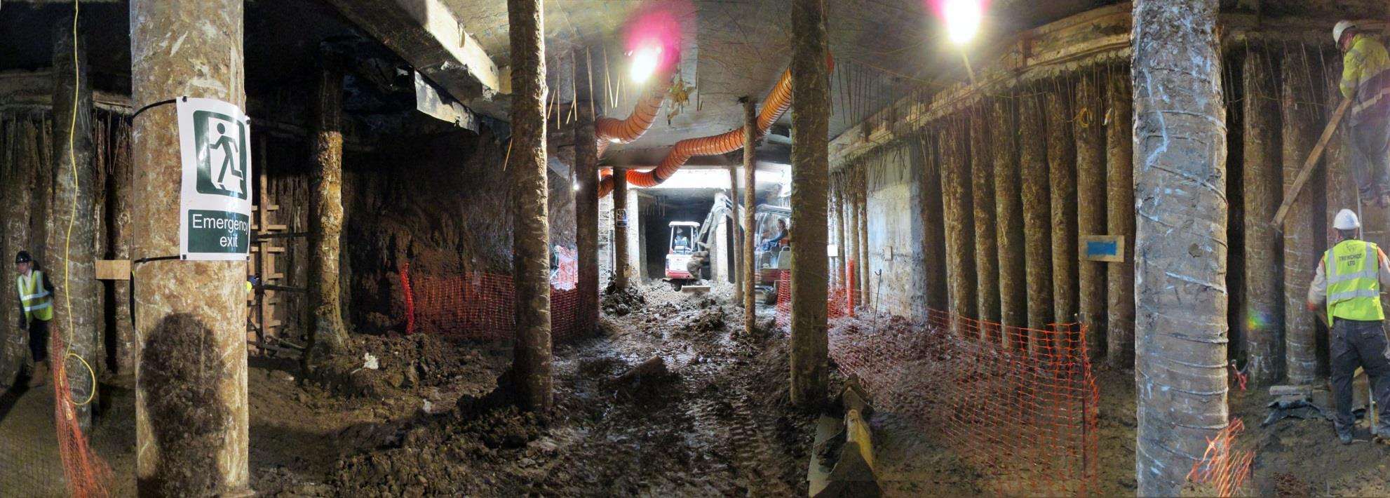 Hand-dug underpinning bays beneath St John’s Wood, photographed at night.